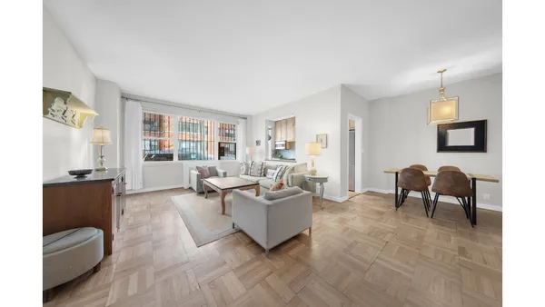 a living room with furniture and a window