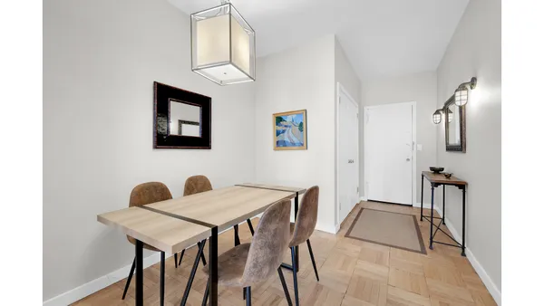 a kitchen with stainless steel appliances a sink a stove and cabinets