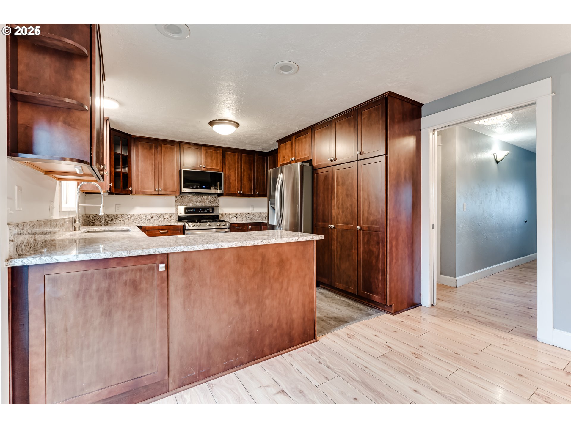 2230 Viewmont Avenue Springfield, OR 97477 - Photo 11 of 40 a kitchen with stainless steel appliances granite countertop a refrigerator a stove top oven a sink and dishwasher
