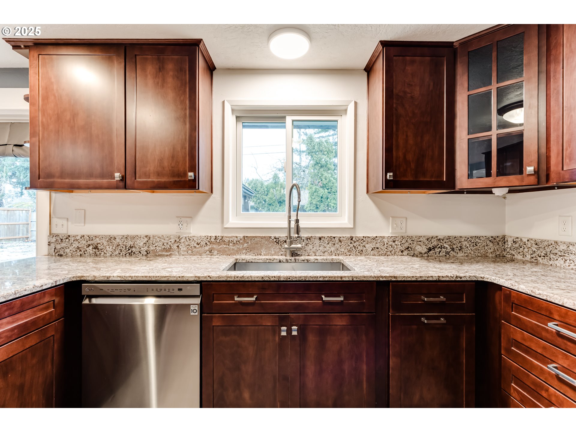 2230 Viewmont Avenue Springfield, OR 97477 - Photo 13 of 40 a kitchen with granite countertop cabinets sink and window