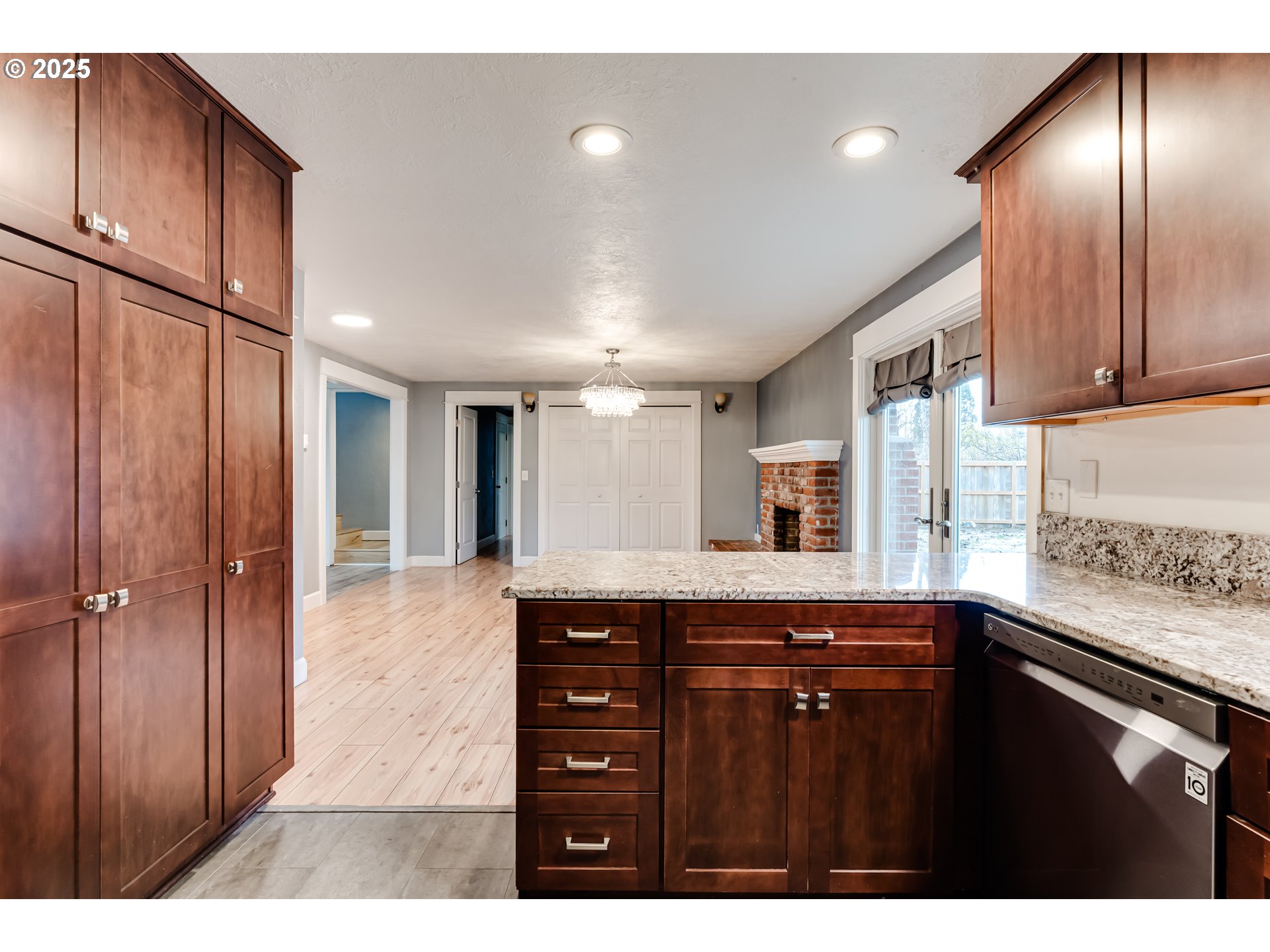 2230 Viewmont Avenue Springfield, OR 97477 - Photo 14 of 40 a kitchen with a sink a refrigerator and cabinets