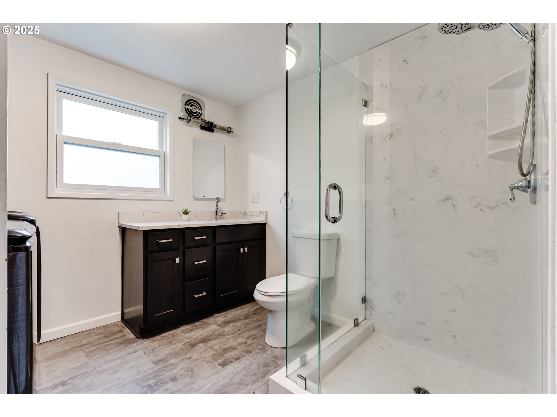 2230 Viewmont Avenue Springfield, OR 97477 - Photo 23 of 40 a bathroom with a double vanity sink toilet mirror and shower