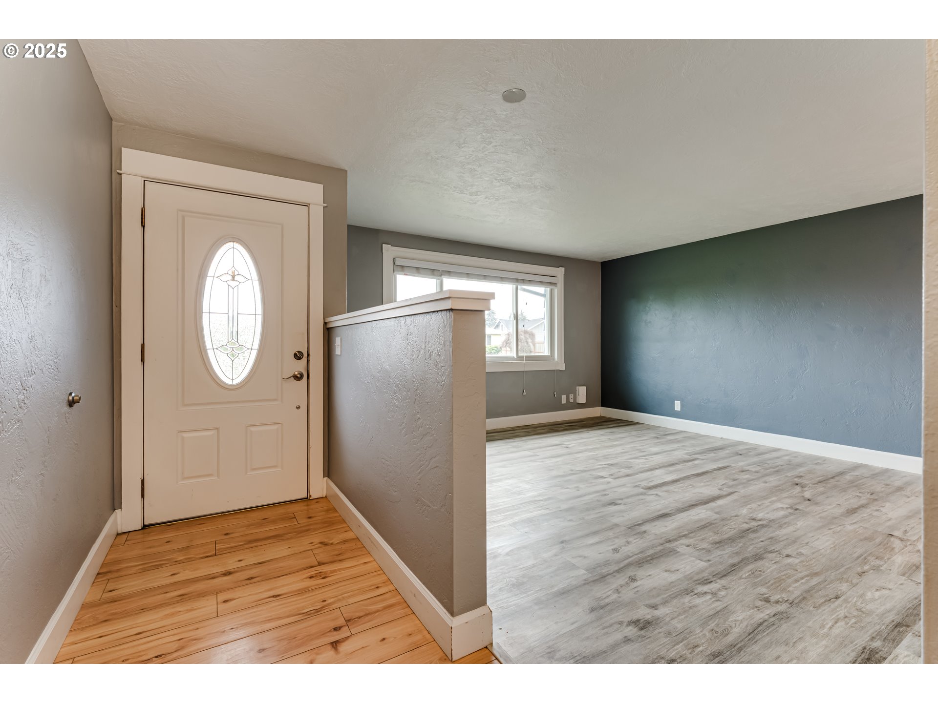 2230 Viewmont Avenue Springfield, OR 97477 - Photo 3 of 40 a view of empty room with window and wooden floor