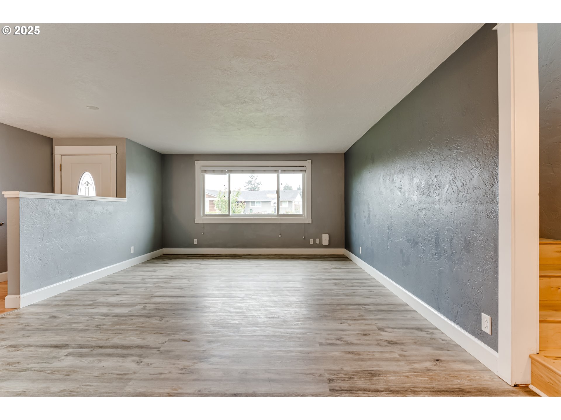 2230 Viewmont Avenue Springfield, OR 97477 - Photo 5 of 40 a view of empty room with wooden floor and fan