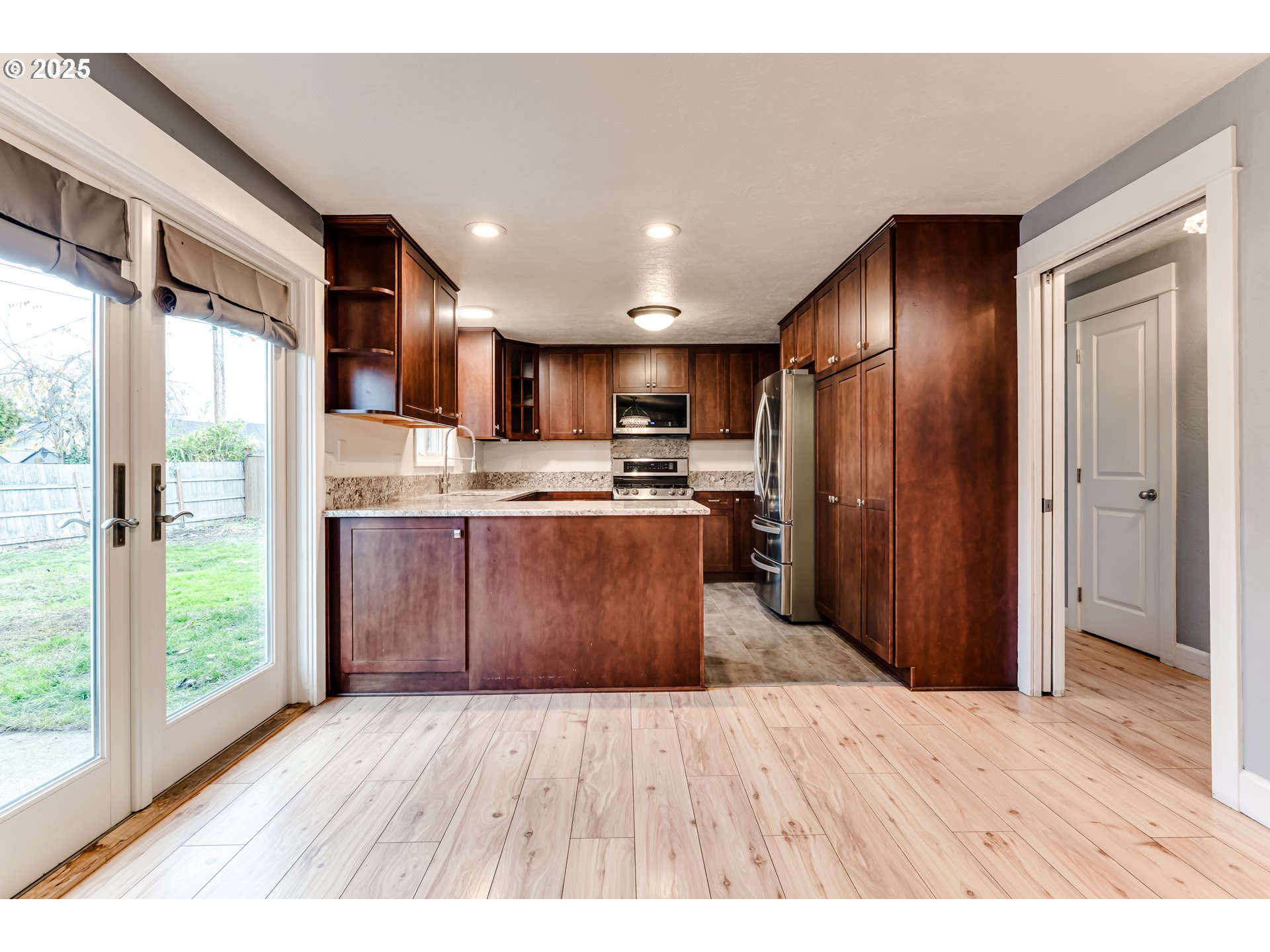 2230 Viewmont Avenue Springfield, OR 97477 - Photo 10 of 40 a kitchen with stainless steel appliances granite countertop a refrigerator a sink dishwasher a stove and a wooden cabinets