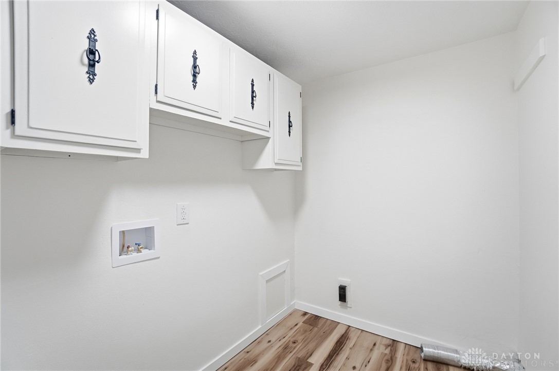1923 Portage Path Springfield, OH 45506 - Photo 20 of 40 Functional utility space with sleek cabinetry and durable flooring for everyday needs.