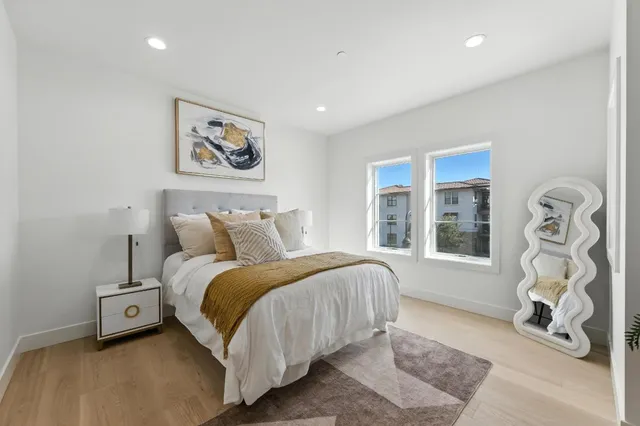 a bedroom with bed and a window