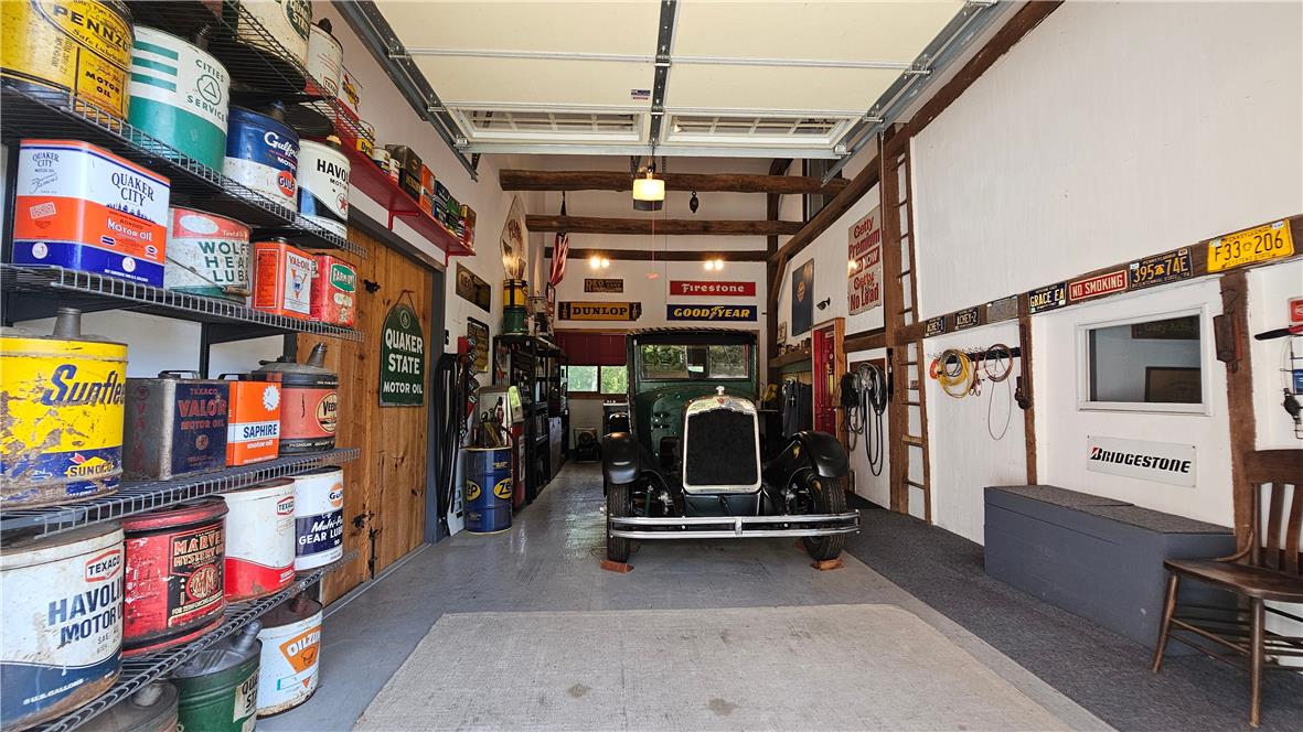 585 Buttermilk Road Hellertown, PA 18055 - Photo 68 of 82 Showcasing a collector's dream, this spacious garage offers robust storage and ample room for cherished vehicles.