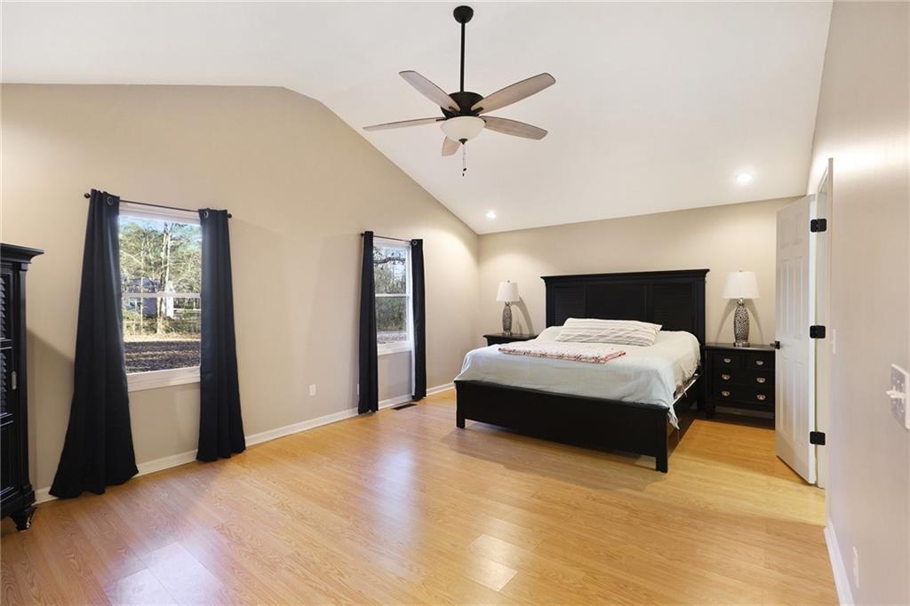 315 Laurel Road Carrollton, GA 30117 - Photo 17 of 30 a bedroom with a bed and a chandelier