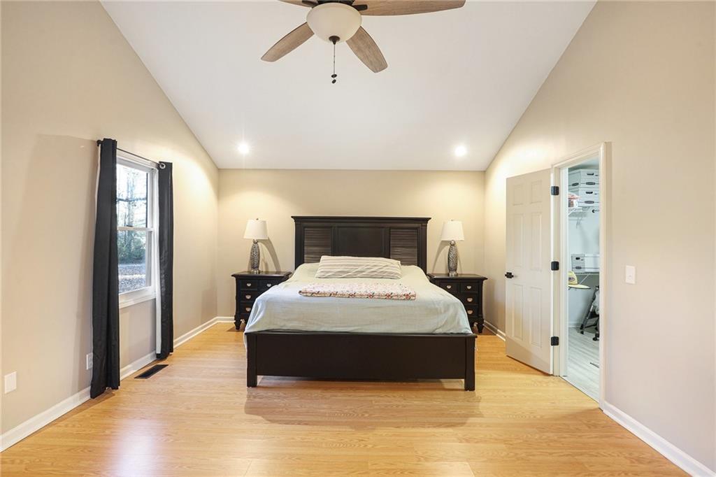 315 Laurel Road Carrollton, GA 30117 - Photo 20 of 30 a spacious bedroom with a bed and wooden floor