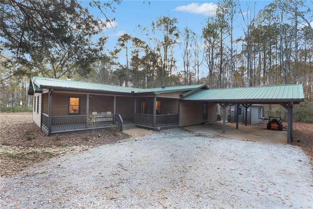 315 Laurel Road Carrollton, GA 30117 - Photo 2 of 30 a view of a house with a yard and sitting area