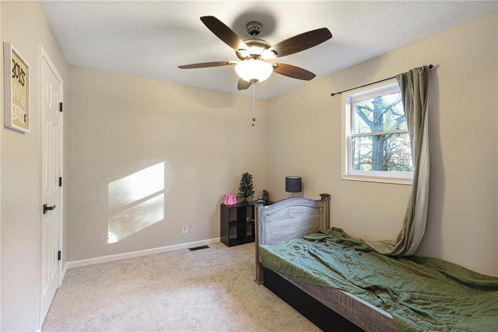 315 Laurel Road Carrollton, GA 30117 - Photo 26 of 30 a living room with furniture and a window