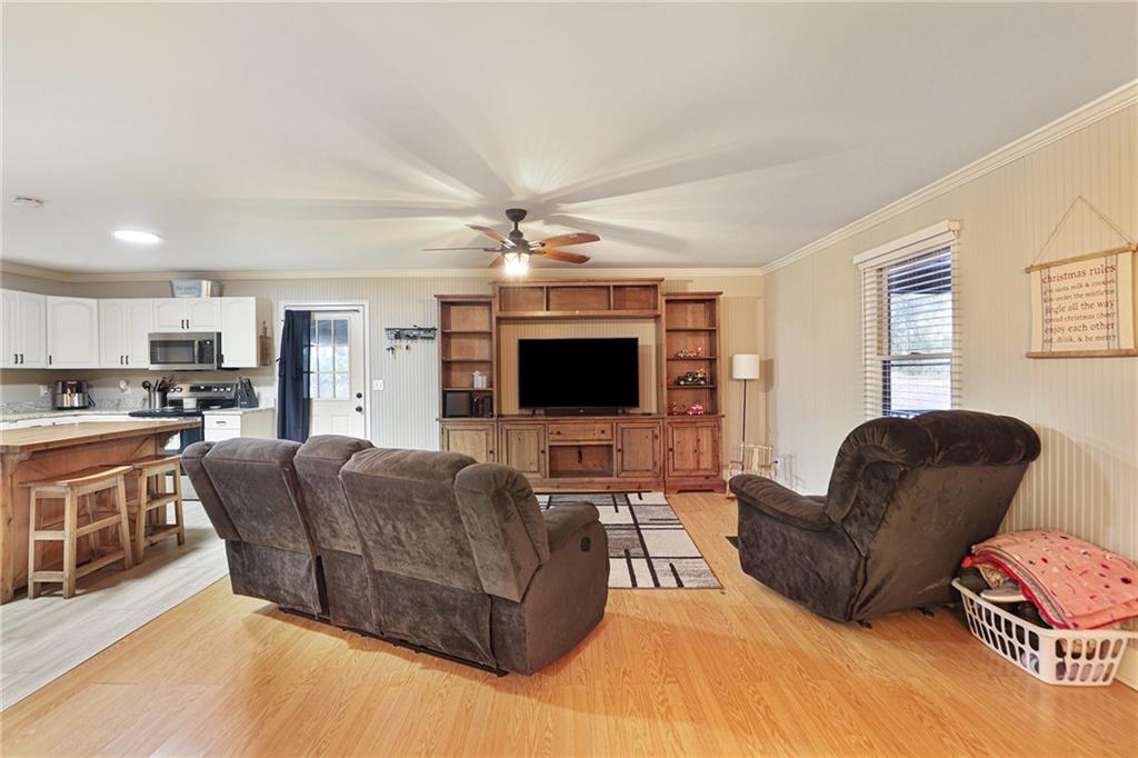 315 Laurel Road Carrollton, GA 30117 - Photo 8 of 30 a living room with furniture and a flat screen tv