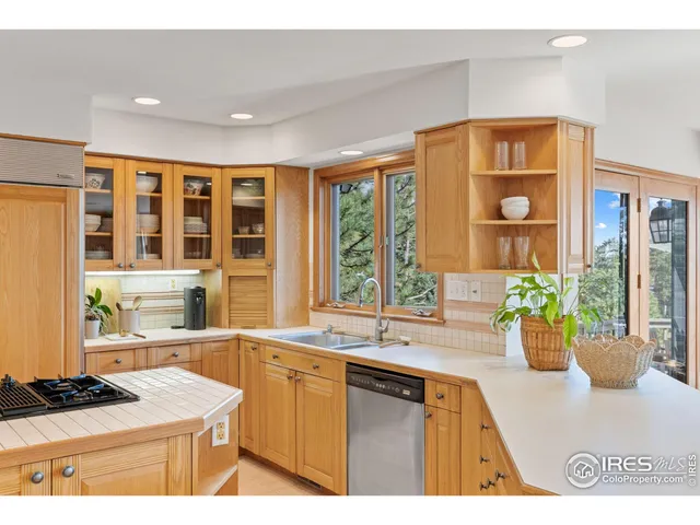 a kitchen with a sink and a large window