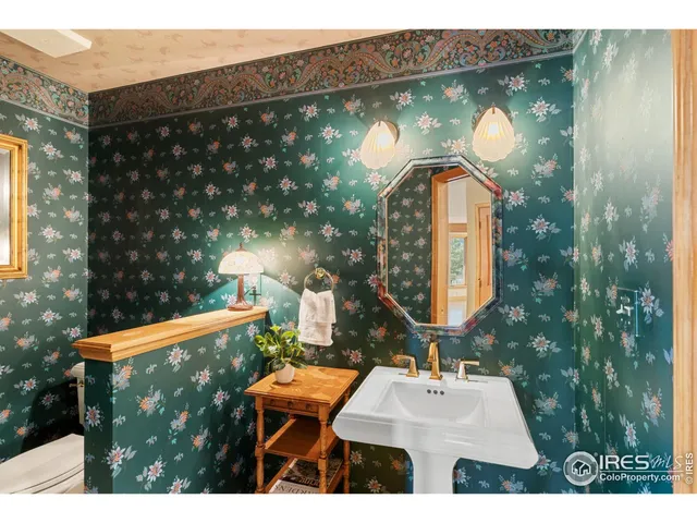 a bathroom with a sink mirror and vanity