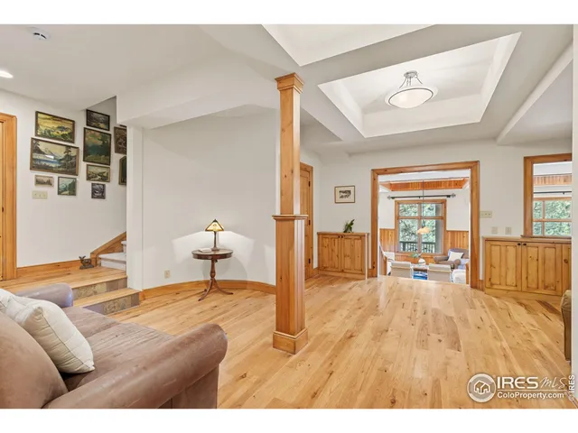 a bedroom with furniture and a large window
