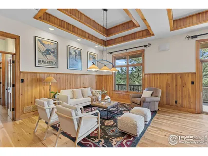 a living room with furniture a window and a dining table
