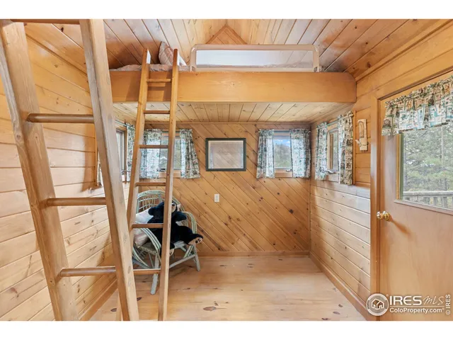 a view of a room with furniture and windows