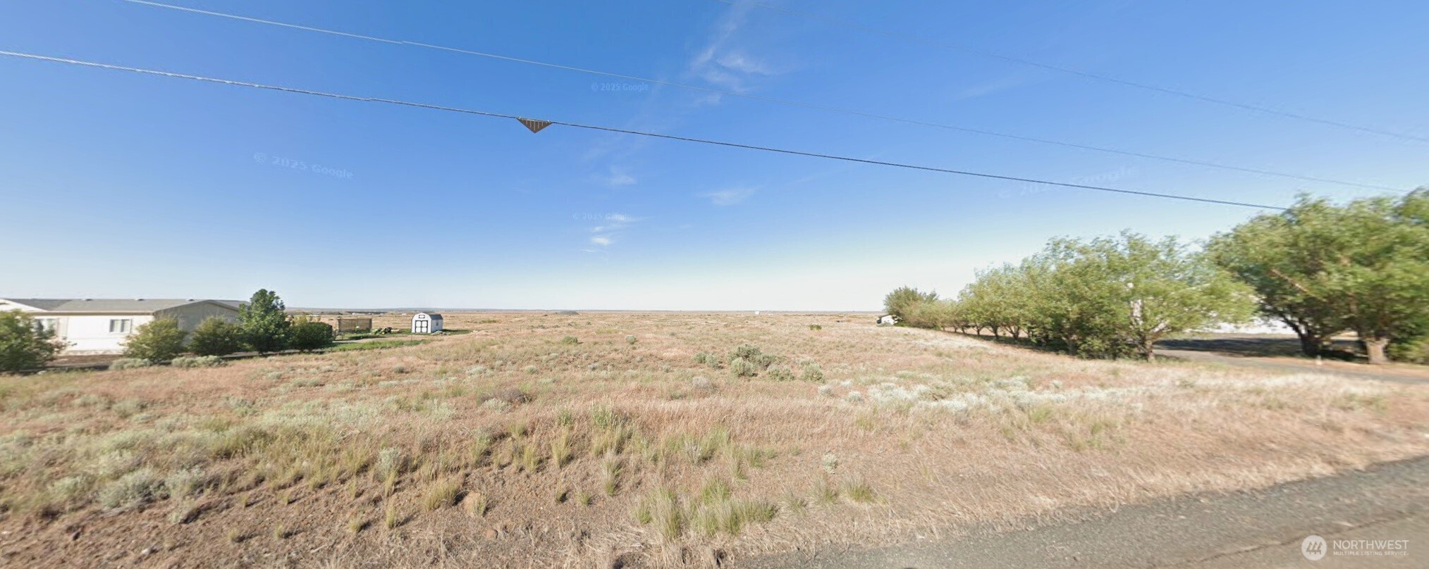 13201 Drumheller Road Northwest Ephrata, WA 98823 - Photo 1 of 1 a view of a dirt road and a building