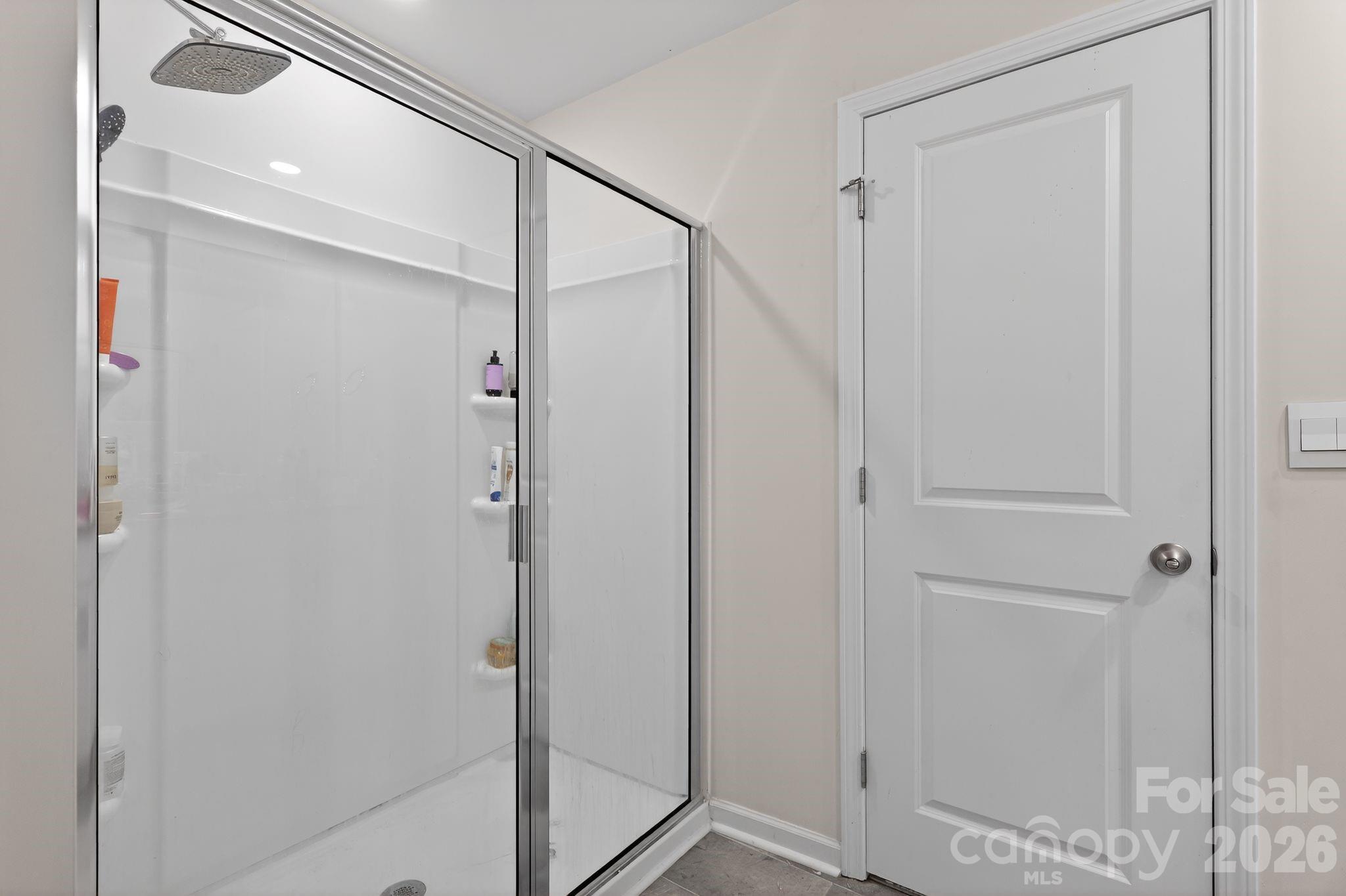 137 North Ranney Way Mooresville, NC 28117 - Photo 19 of 30 a bathroom with a shower and a glass door