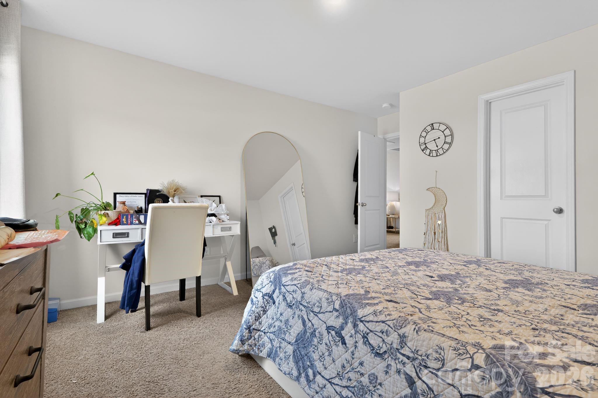 137 North Ranney Way Mooresville, NC 28117 - Photo 21 of 30 a bedroom with a bed and a chandelier