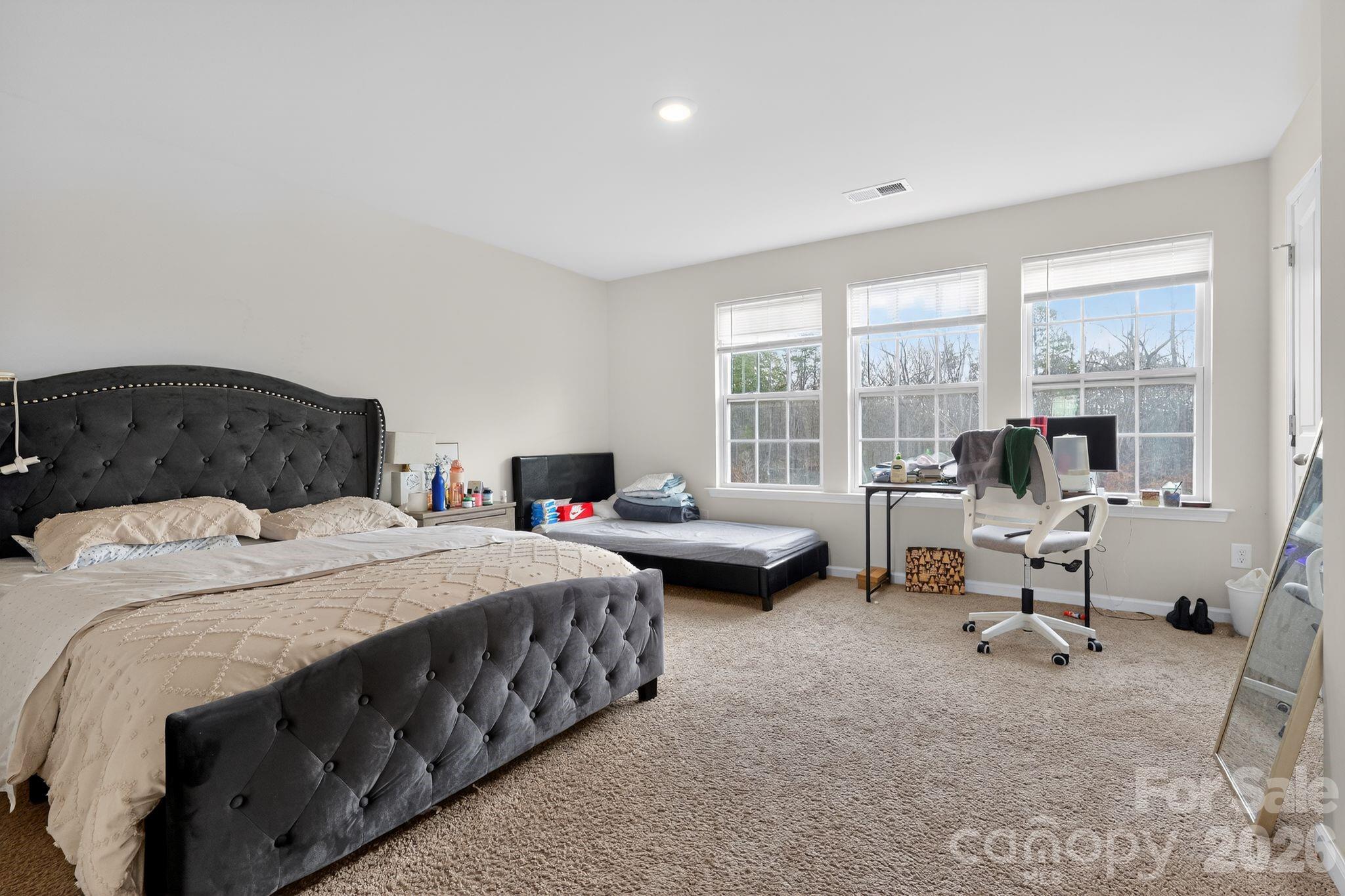 137 North Ranney Way Mooresville, NC 28117 - Photo 22 of 30 a bedroom with bed and a large window