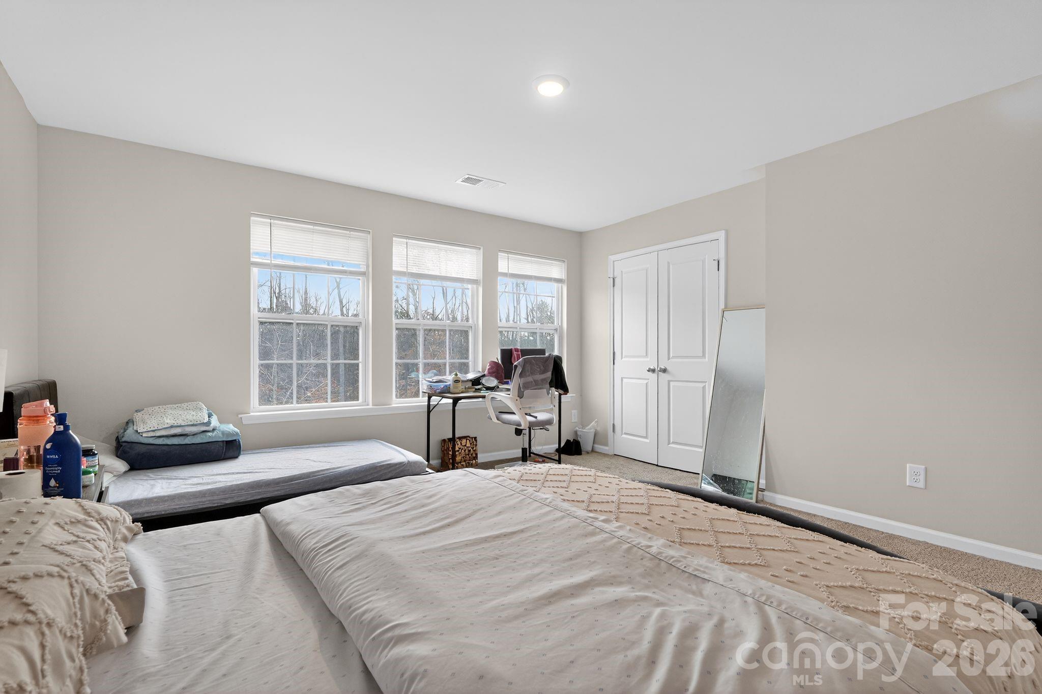 137 North Ranney Way Mooresville, NC 28117 - Photo 23 of 30 a bed room with a bed and a couch