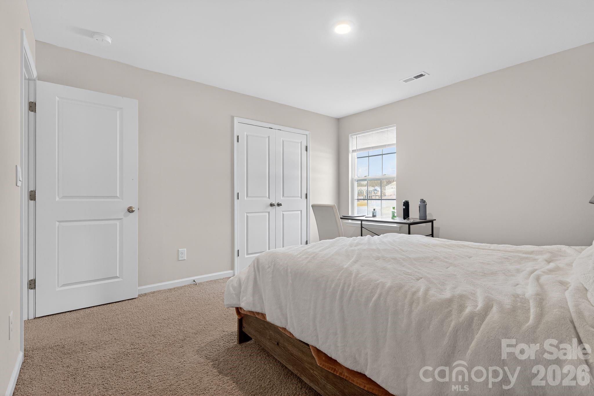 137 North Ranney Way Mooresville, NC 28117 - Photo 25 of 30 a bedroom with a bed and a window