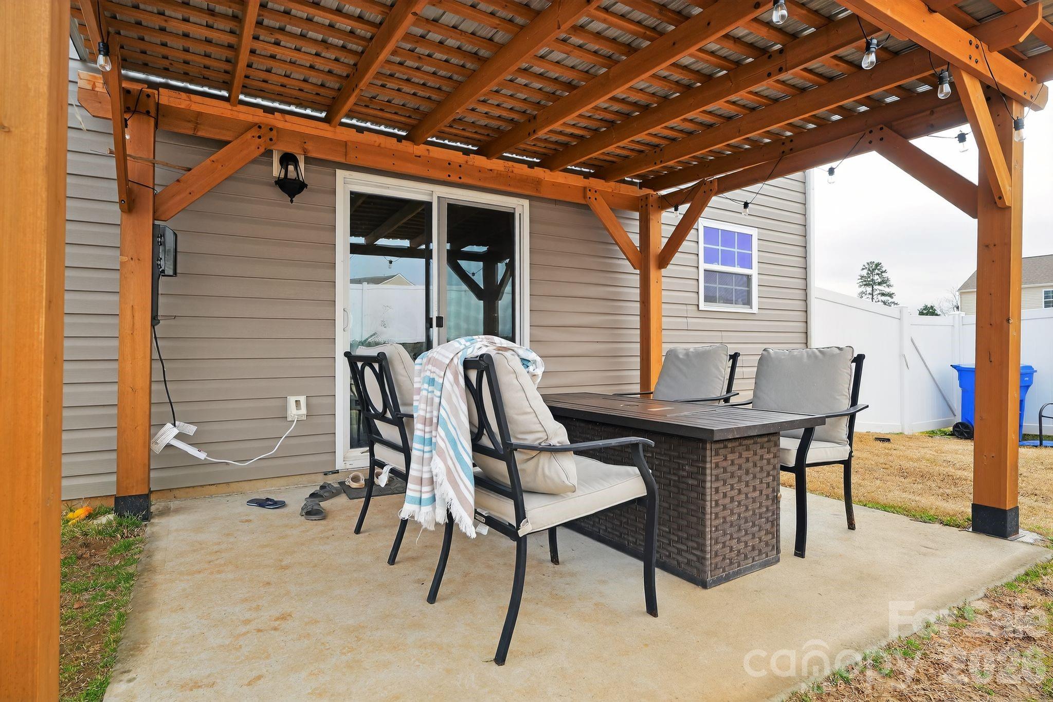 137 North Ranney Way Mooresville, NC 28117 - Photo 27 of 30 a backyard of a house with table and chairs