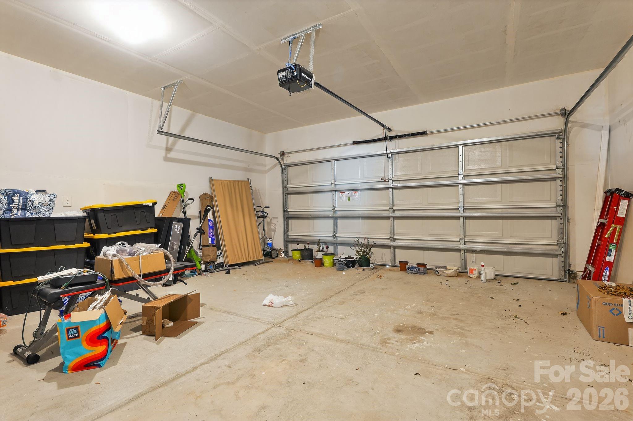 137 North Ranney Way Mooresville, NC 28117 - Photo 30 of 30 a view of a garage with a bike and a car