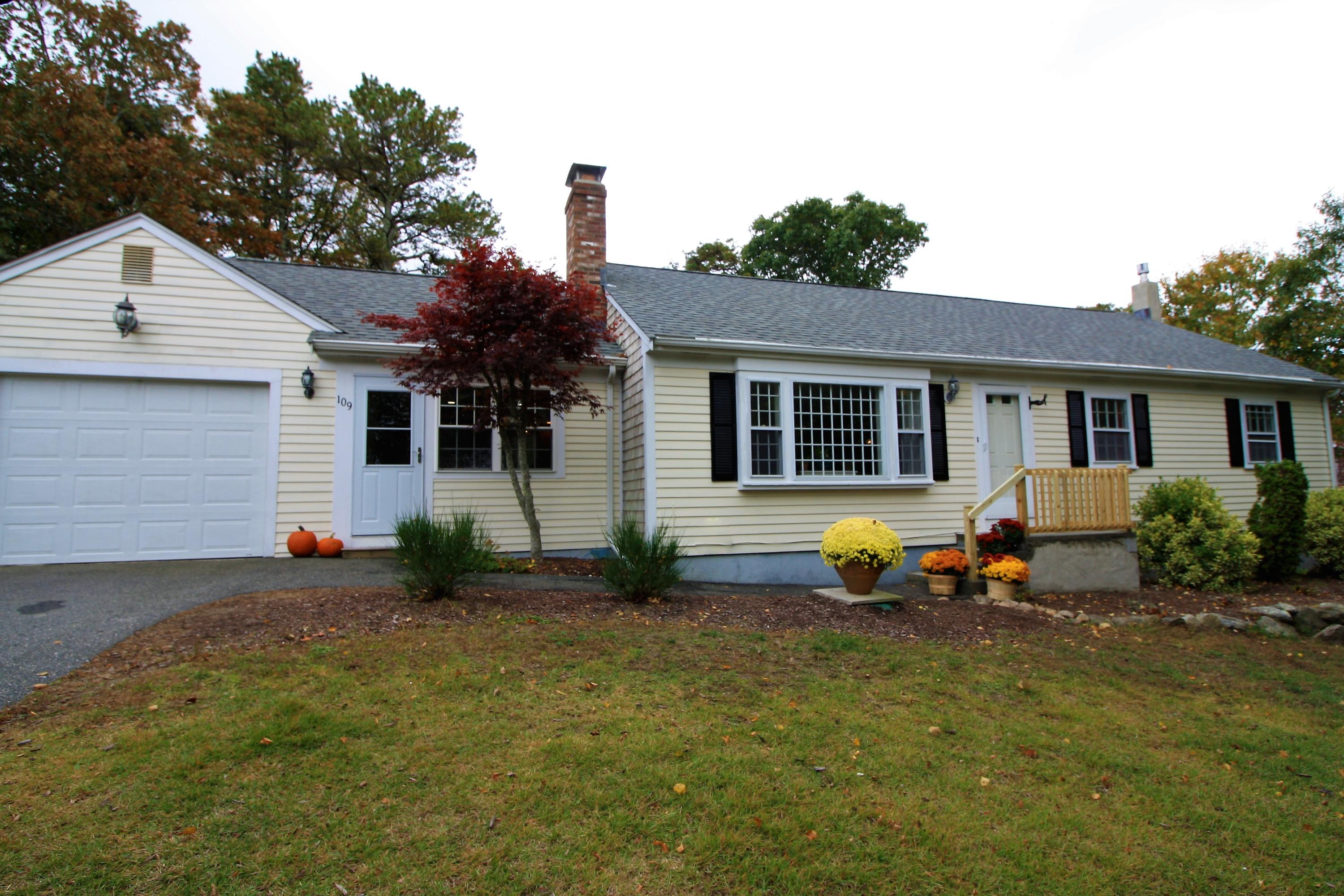 109 Pompano Road Yarmouth Port, MA 02675 - Photo 1 of 42 a backyard of a house with table and chairs