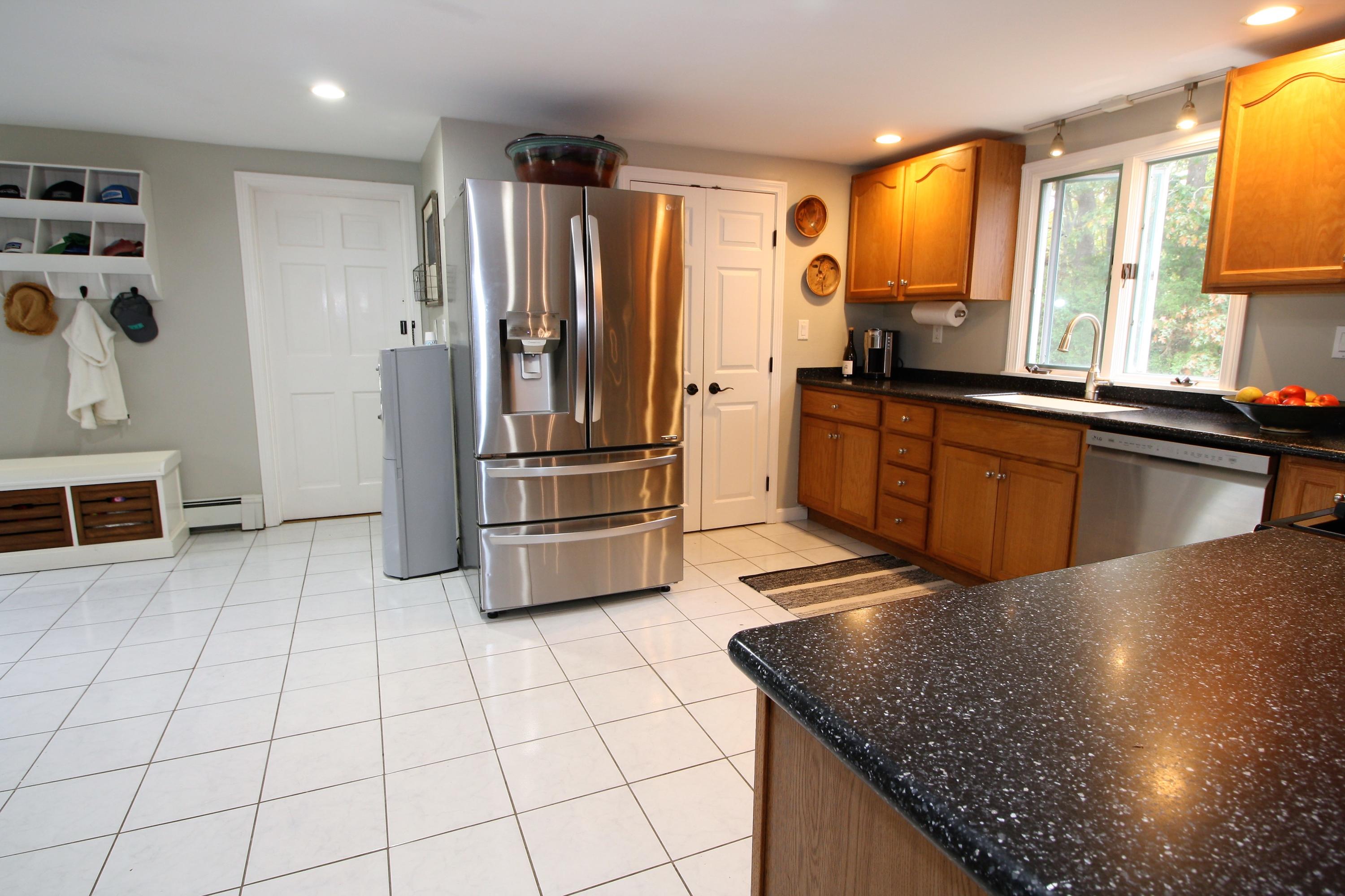 109 Pompano Road Yarmouth Port, MA 02675 - Photo 10 of 42 a kitchen with stainless steel appliances granite countertop a refrigerator a stove and a sink
