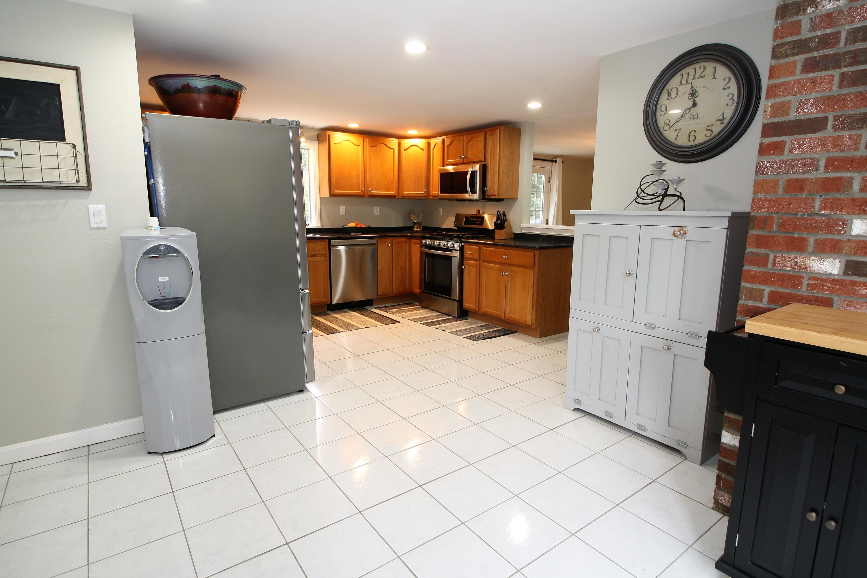 109 Pompano Road Yarmouth Port, MA 02675 - Photo 13 of 42 a kitchen with stainless steel appliances granite countertop a refrigerator a stove and a sink