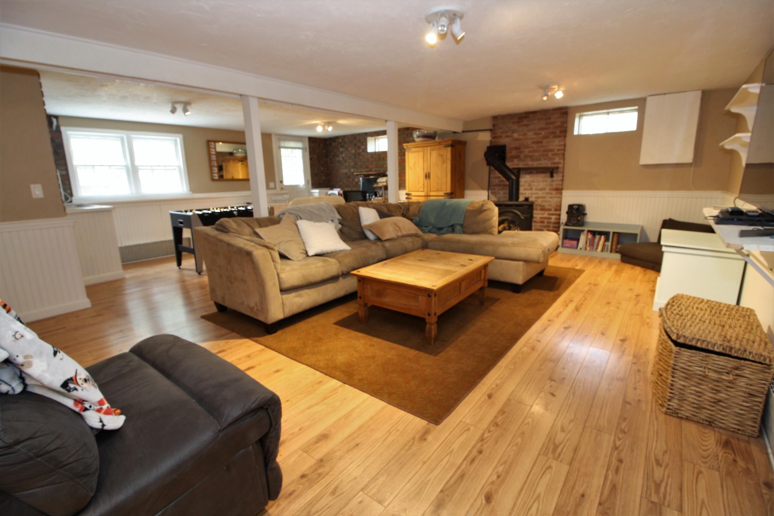 109 Pompano Road Yarmouth Port, MA 02675 - Photo 25 of 42 a living room with furniture or couch and a wooden floor
