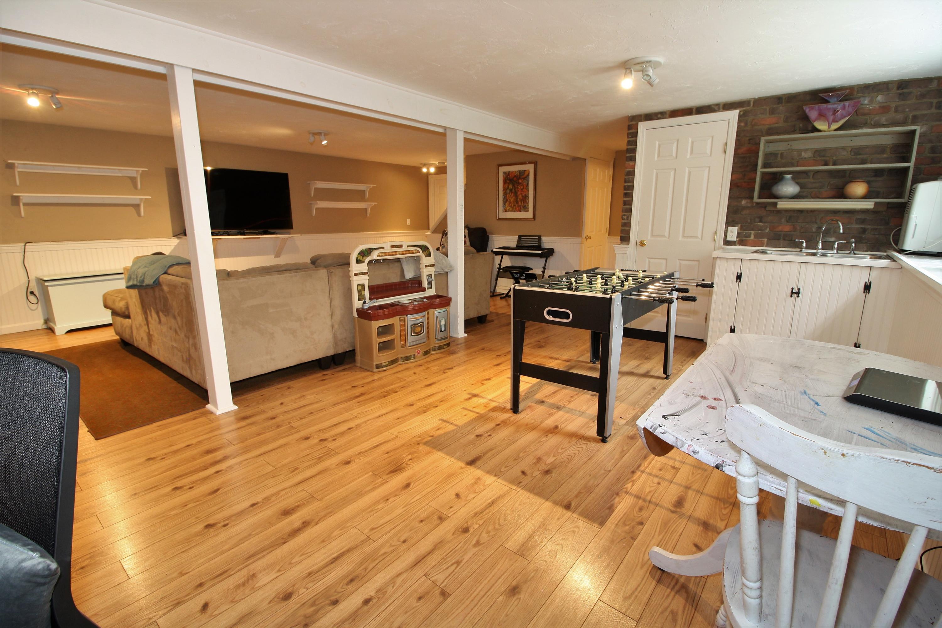 109 Pompano Road Yarmouth Port, MA 02675 - Photo 27 of 42 a living room with furniture and a flat screen tv