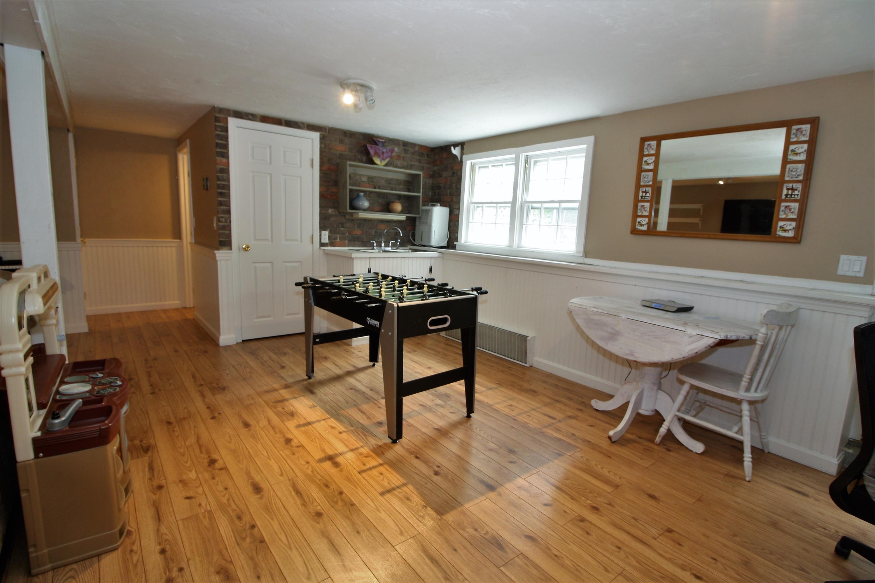 109 Pompano Road Yarmouth Port, MA 02675 - Photo 28 of 42 a workspace with furniture window and wooden floor