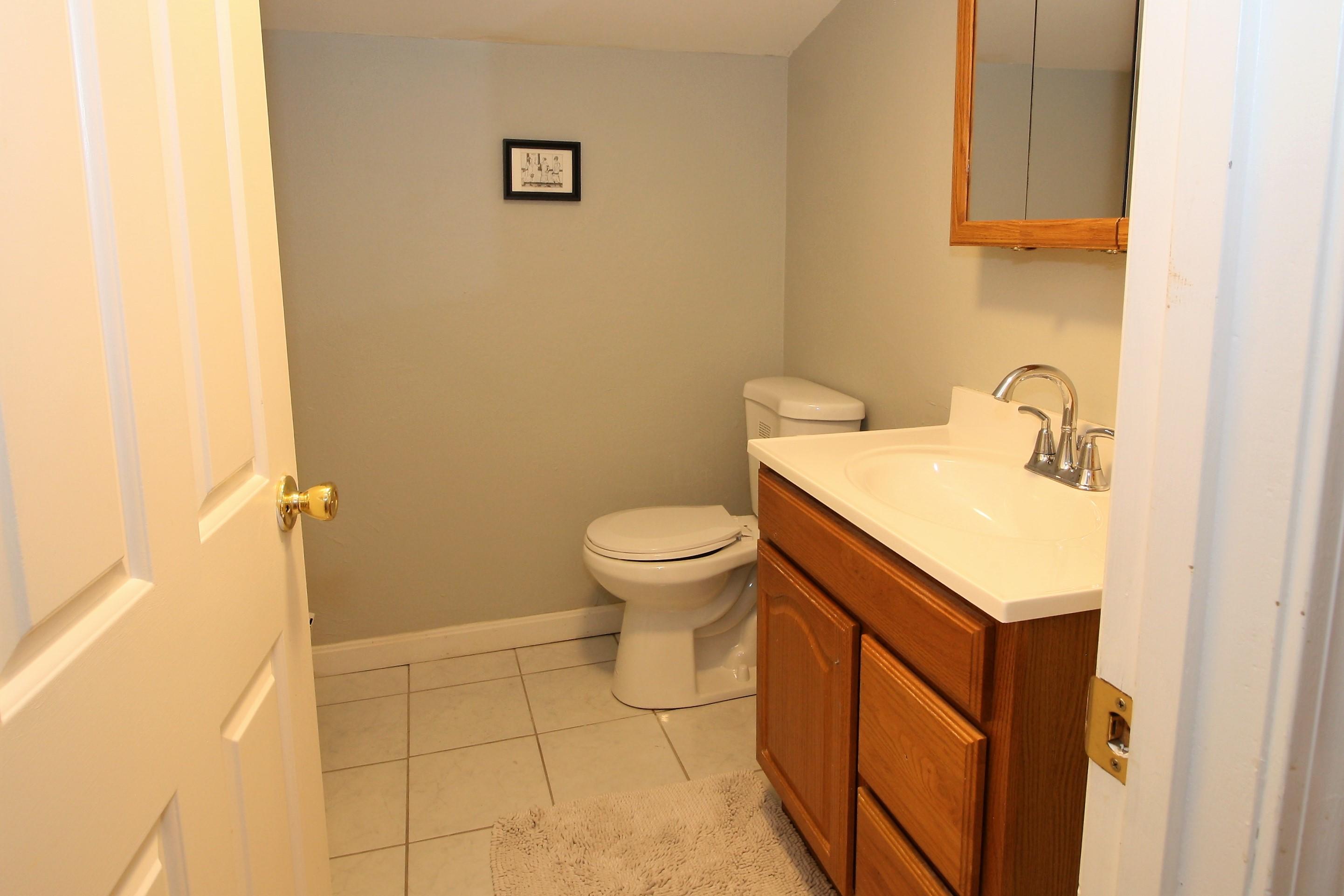 109 Pompano Road Yarmouth Port, MA 02675 - Photo 29 of 42 a bathroom with a sink a toilet and a mirror