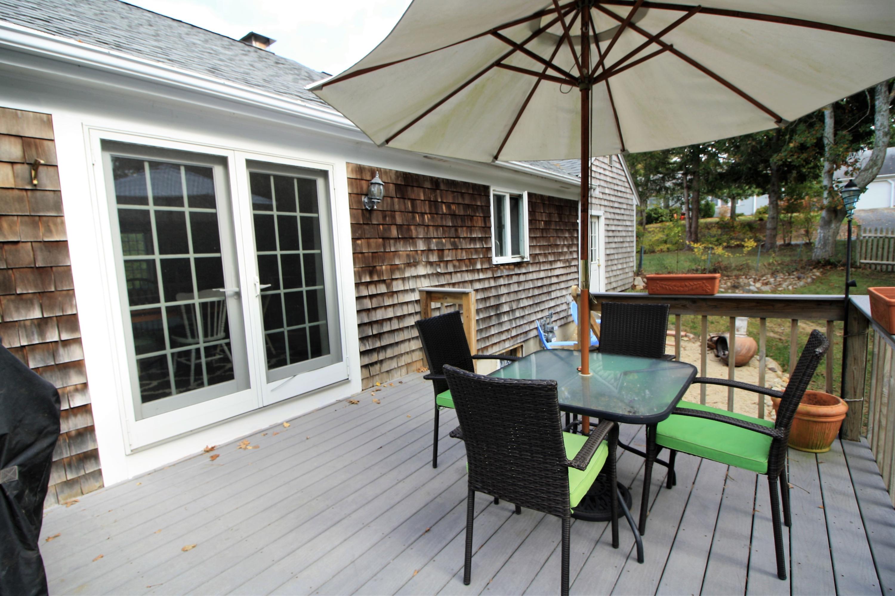 109 Pompano Road Yarmouth Port, MA 02675 - Photo 31 of 42 a patio with table and chairs