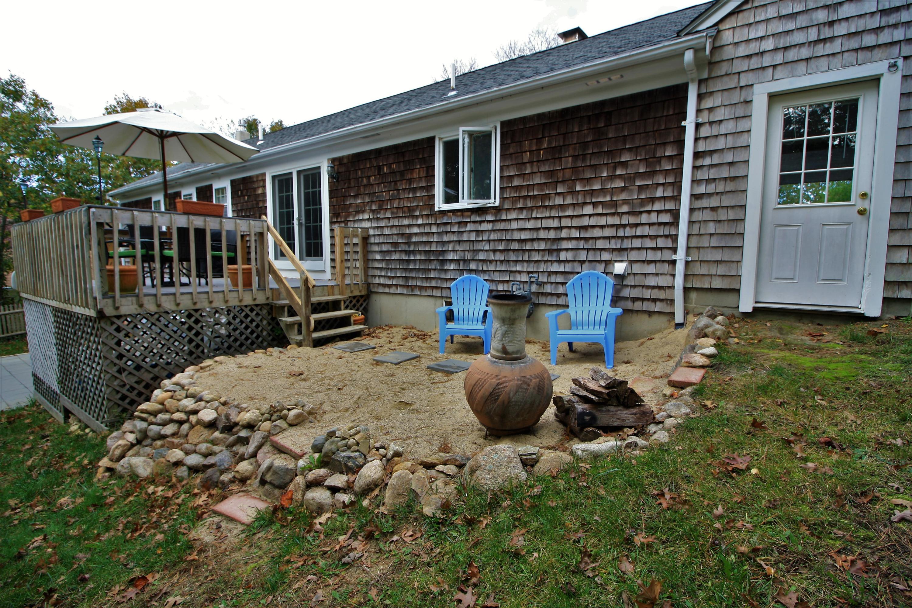 109 Pompano Road Yarmouth Port, MA 02675 - Photo 35 of 42 a backyard of a house with seating space