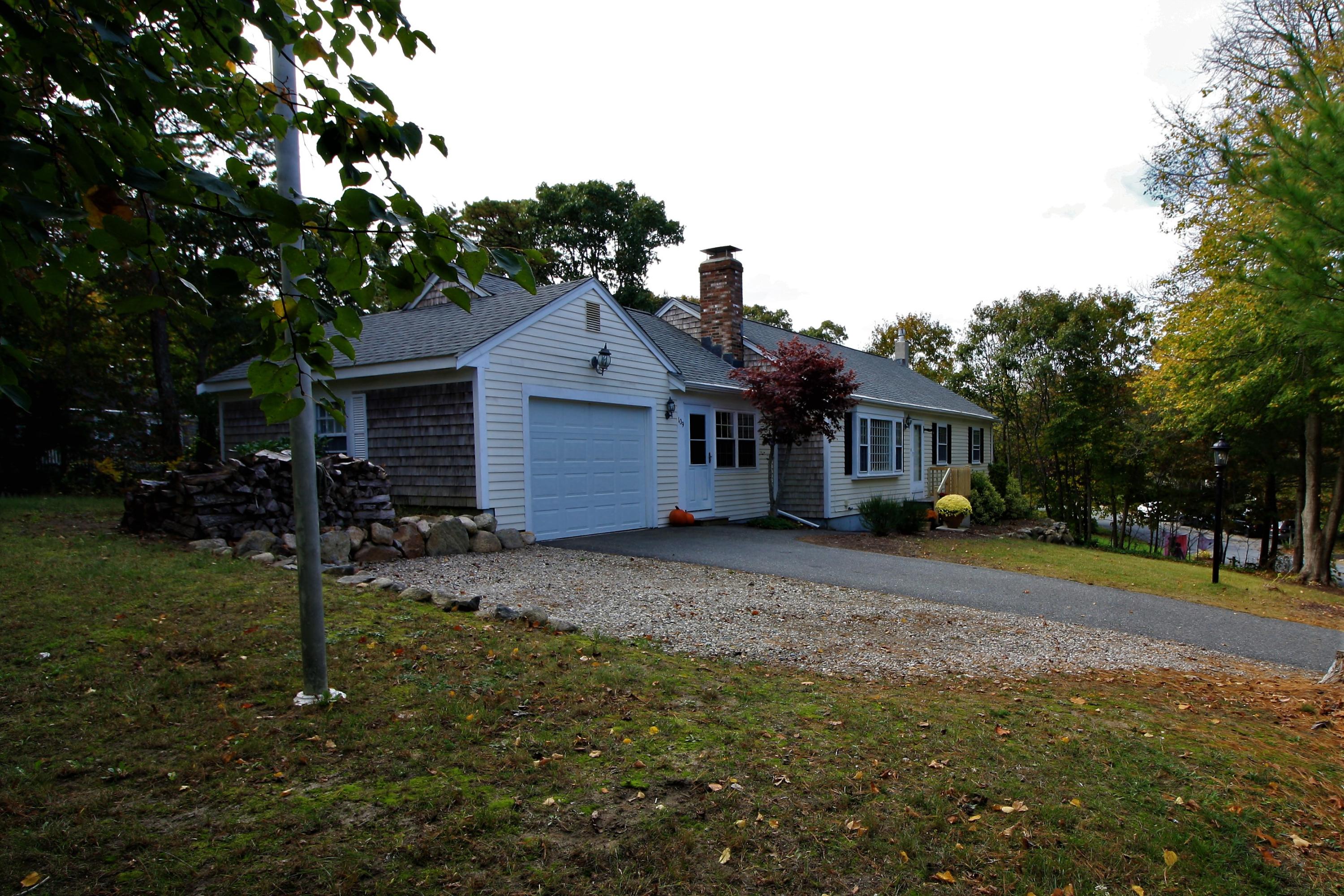109 Pompano Road Yarmouth Port, MA 02675 - Photo 39 of 42 a front view of a house with a garden
