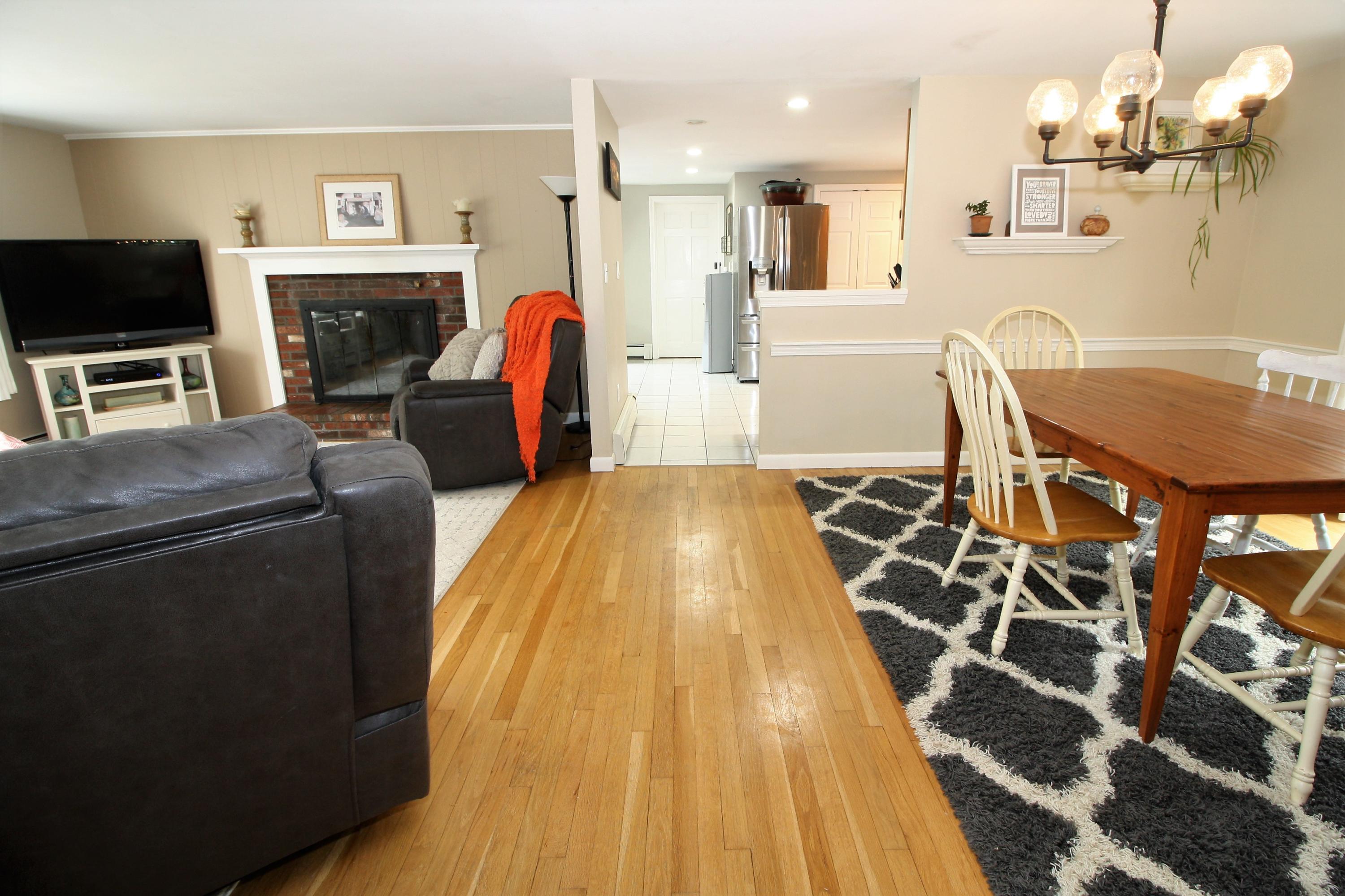 109 Pompano Road Yarmouth Port, MA 02675 - Photo 40 of 42 a living room with furniture a fireplace and a flat screen tv