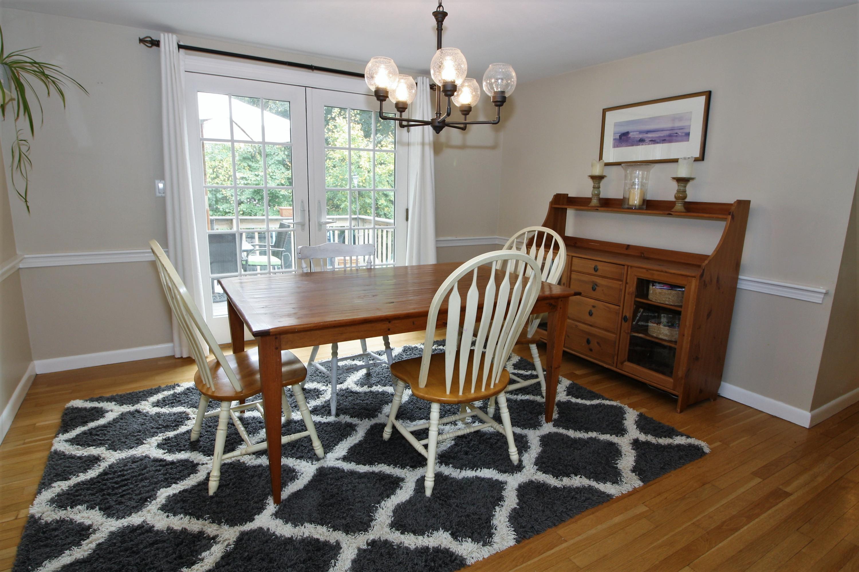 109 Pompano Road Yarmouth Port, MA 02675 - Photo 8 of 42 a view of a dining room with furniture and wooden floor