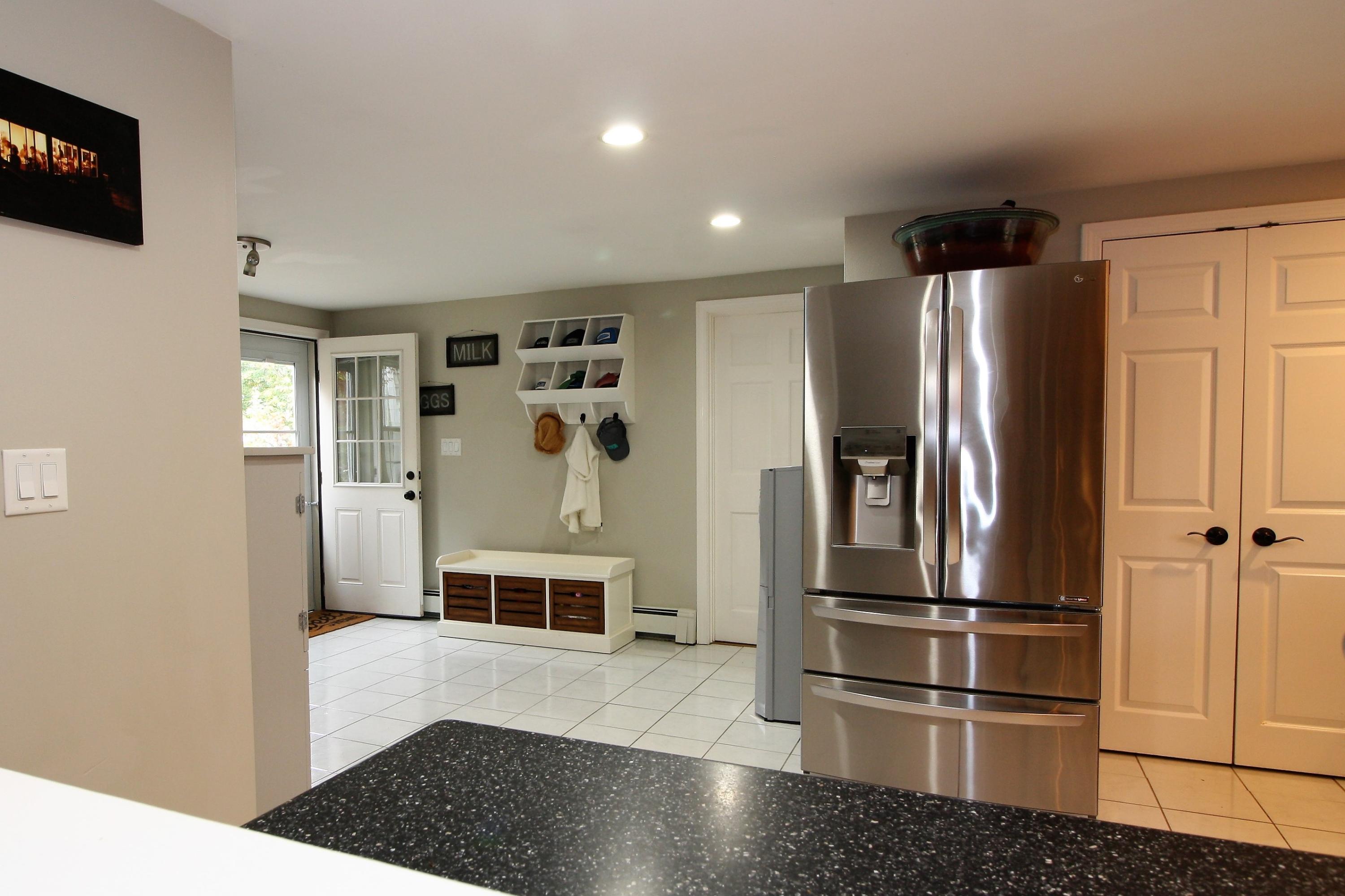 109 Pompano Road Yarmouth Port, MA 02675 - Photo 9 of 42 a kitchen with stainless steel appliances granite countertop a refrigerator a stove and a sink