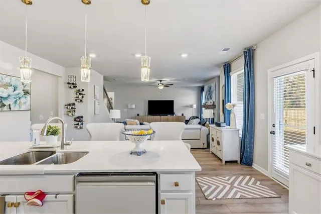 a kitchen with stainless steel appliances a sink and cabinets