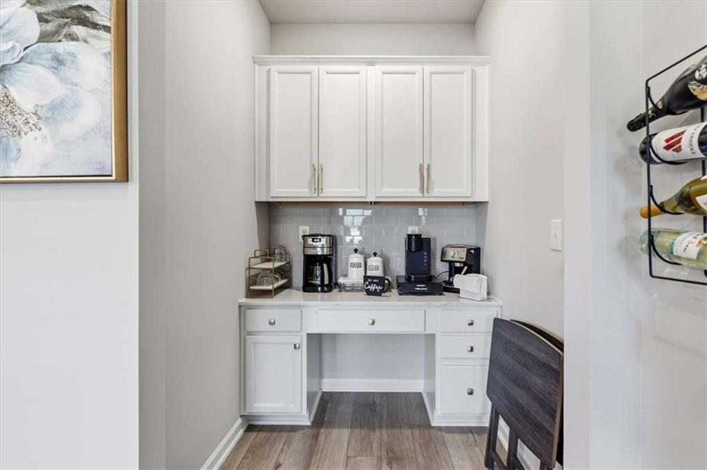 1171 Bodega Loop Locust Grove, GA 30248 - Photo 17 of 57 a kitchen with stainless steel appliances a sink and cabinets