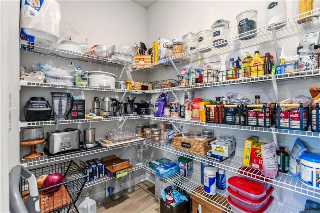 1171 Bodega Loop Locust Grove, GA 30248 - Photo 18 of 57 a store room with stainless steel appliances lots of clutter and water view