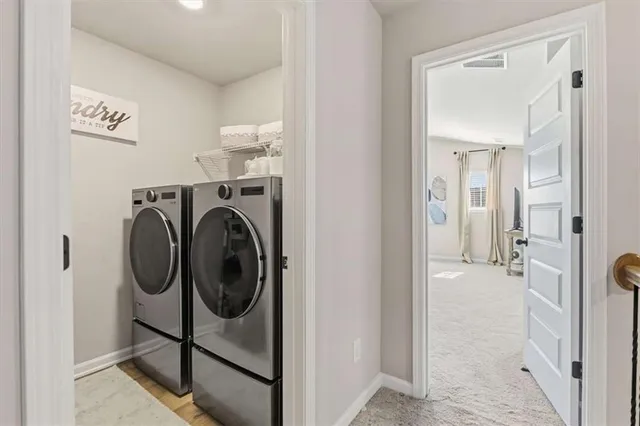 a bedroom with a bed a couch and a flat screen tv