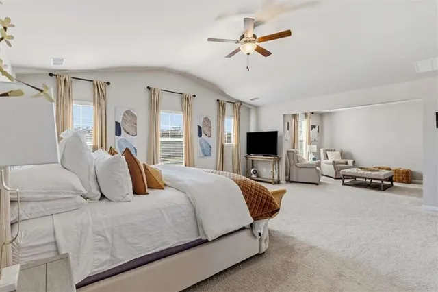 a bedroom with a bed and cabinets