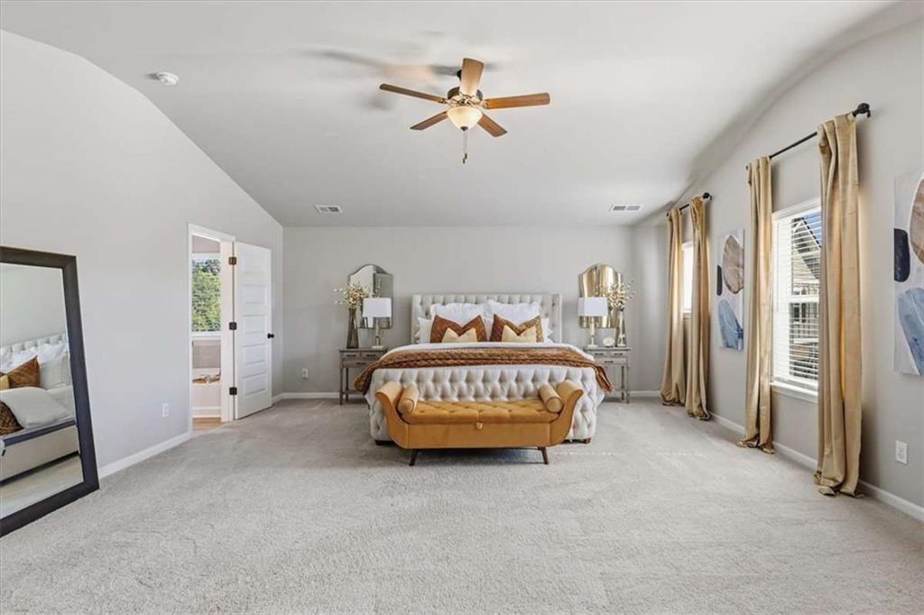 1171 Bodega Loop Locust Grove, GA 30248 - Photo 25 of 57 a bedroom with a bed and cabinets