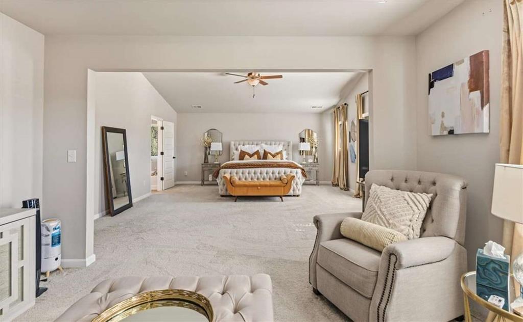 1171 Bodega Loop Locust Grove, GA 30248 - Photo 27 of 57 a living room with furniture and a couch